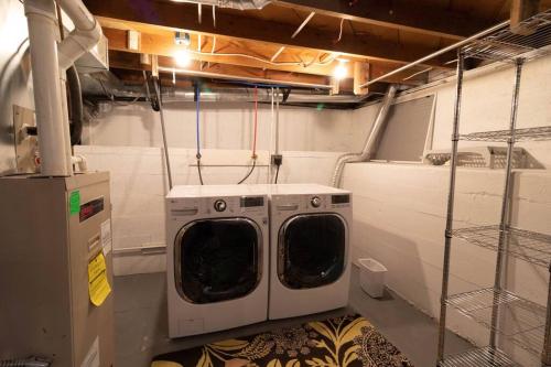 a laundry room with a washing machine in it at East Bench Bungalow A Relaxing Ogden Escape Near Mountains and Downtown in Ogden