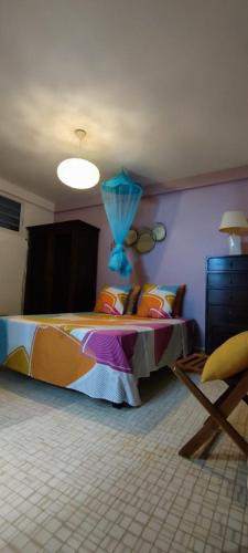 Llit o llits en una habitació de casahibiscus