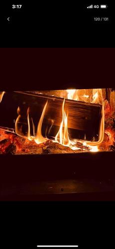 a oven with fire inside of it at Patagonia Home in Shimoda