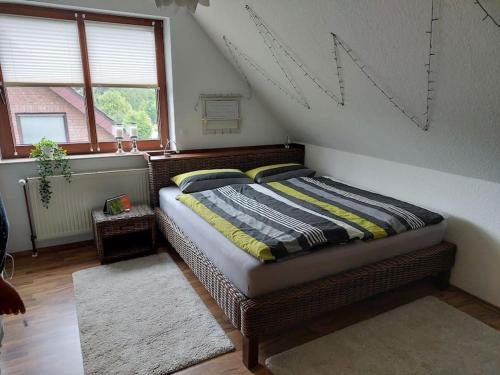a bedroom with a bed in a attic at Schöne voll ausgestattete Ferienwohnung in Havixbeck