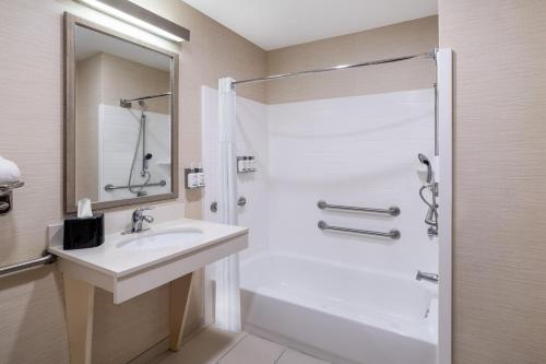 a bathroom with a sink and a shower at Garner Hotel Macon West, an IHG Hotel in Macon