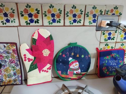 a shelf with christmas decorations on a wall at Lot # 7 ~ Large, Energetic Baja House in Guaymas