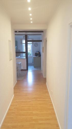 a hallway of a house with a hard wood floor at Moderner Fachwerktraum in Uetze