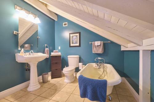 een badkamer met een wastafel, een toilet en een bad bij Marble Saltbox ~ hot tub in Steady Brook
