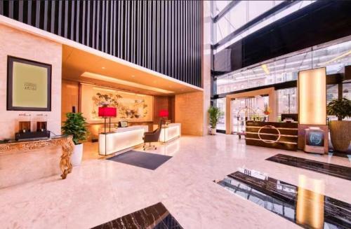 a lobby of a building with a lobby at Enlux Hotel in Jinan