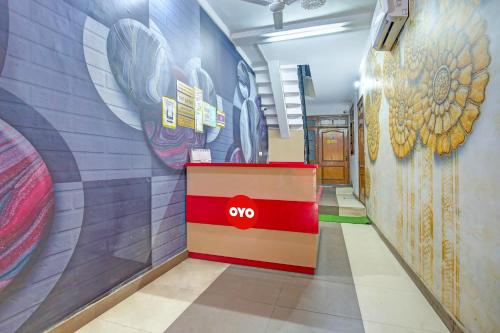 an empty corridor with aoc sign on the wall at OYO HOTEL WINNER INN in Ludhiana