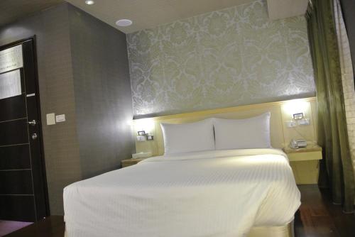 Postel nebo postele na pokoji v ubytování Say Love Hotel