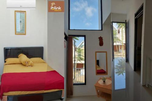 three pictures of a bedroom with a bed in a room at IbLink Homestay Family Homestay di Malang Full AC in Malang