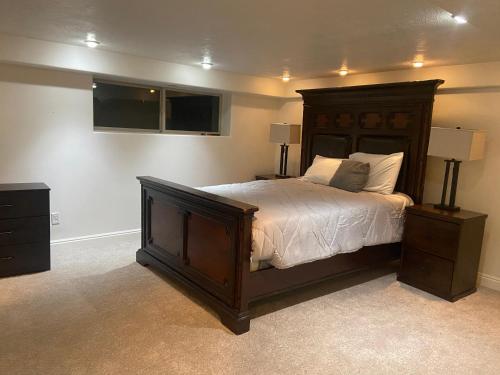 a bedroom with a large bed and two night stands at Wild Rose in Salt Lake City