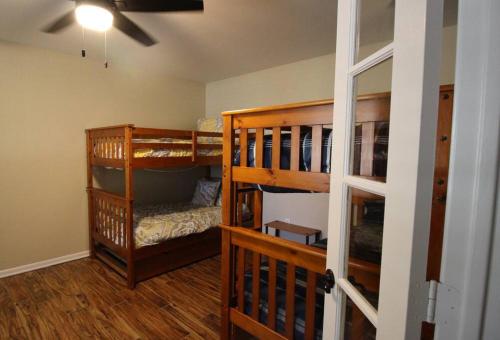 a room with two bunk beds in a room at Cozy Aggieland Vacay in Bryan