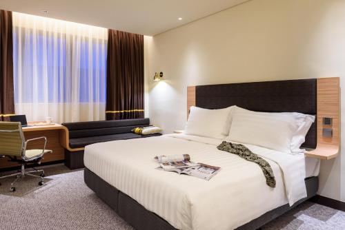 Voodi või voodid majutusasutuse Camlux Hotel toas