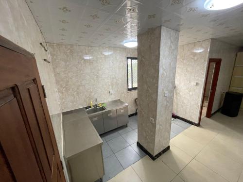 a kitchen with a sink and a counter top at Efate Motel in Port Vila