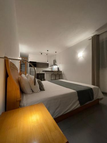a hotel room with a bed and a table at Arkenstone Studios in La Gaulette