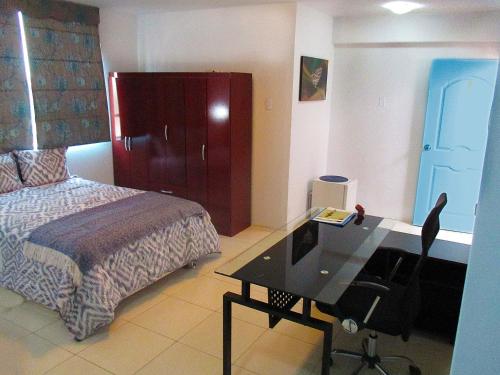 Ένα ή περισσότερα κρεβάτια σε δωμάτιο στο Magicperu Apart Hotel