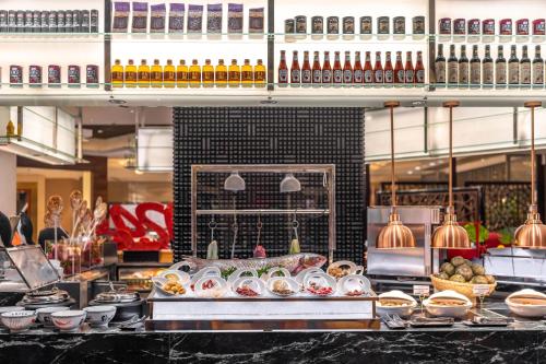 a buffet of food on a counter in a store at Shangri-La Wuhan,Close to The Mixc with three subway lines in Wuhan