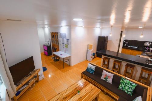 an overhead view of a living room with a couch at El Nido Home Stay in El Nido