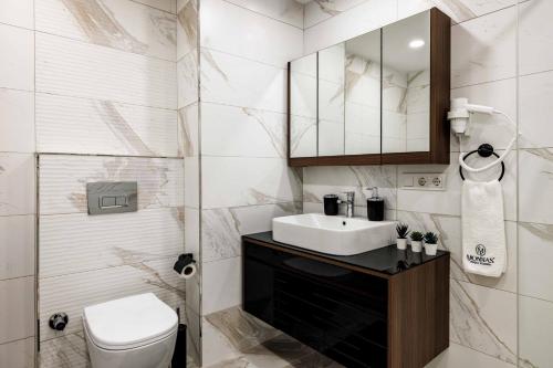 a bathroom with a sink and a toilet at Monnas Suite in Istanbul