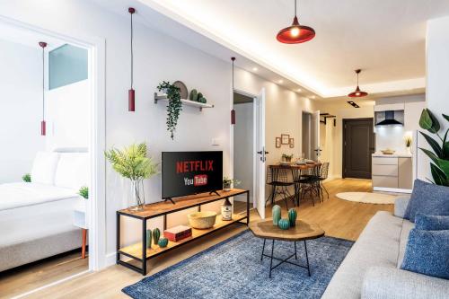 a living room with a couch and a table at Monnas Suite in Istanbul