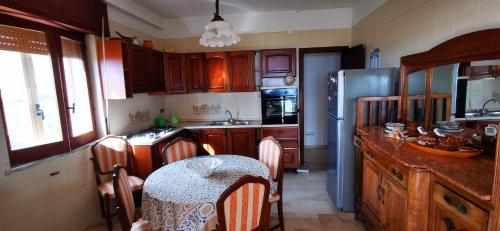 A kitchen or kitchenette at Casa vacanze CALU'