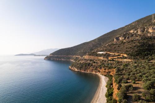 an aerial view of a beach on the side of a mountain at Blue Horizon Suites in Paralion astros