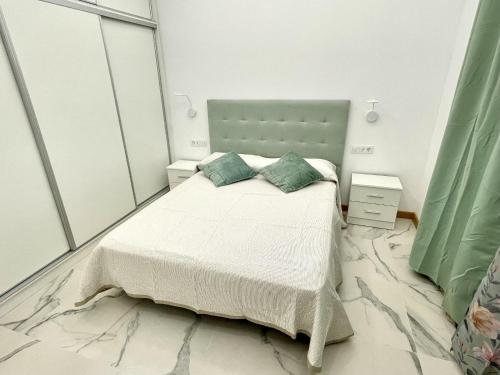 a bedroom with a bed and a large mirror at 1 Island Village with Wi fi and Pool in Adeje