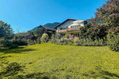 a house on a hill with a large yard at -The Urbanist- Mountainview Parking Garden 3BD in Unterseen