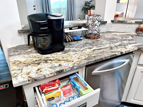 a coffee maker sitting on top of a kitchen counter at Spacious 3 BR near Legacy West in Plano
