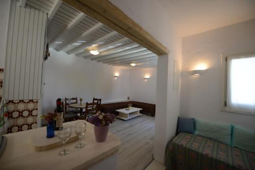 a living room with a couch and a table at Andriani's Guest House in Mýkonos City