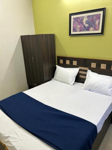 מיטה או מיטות בחדר ב-ELITE INN