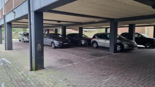 a group of cars parked in a parking lot at City Hotel Winschoten in Winschoten
