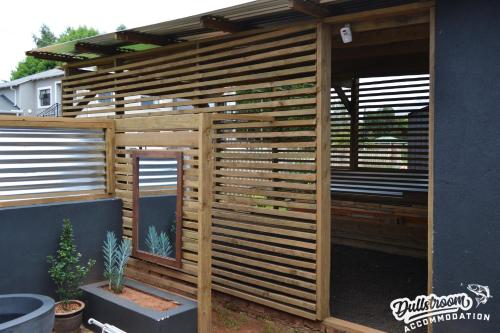 a wooden privacy fence in a backyard at Clarky's Bucketlist in Dullstroom