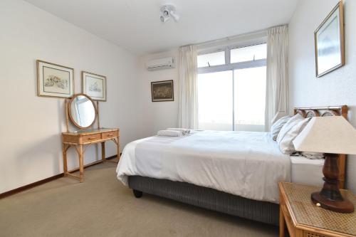 Ένα ή περισσότερα κρεβάτια σε δωμάτιο στο 12 Sea Lodge