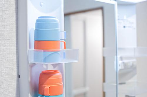 a refrigerator filled with lots of plastic containers at Fukugenkaku - Vacation STAY 14218 in Osaka