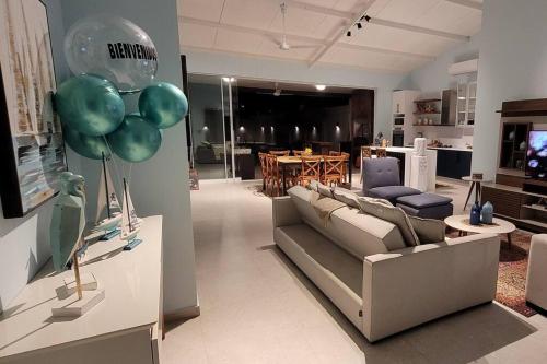 a living room with a couch and balloons in it at Moderna casa en San Bernardino!! in San Bernardino