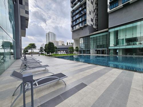 a large building with a pool in the middle of it at Setia Sky88 Johor Bahru in Johor Bahru