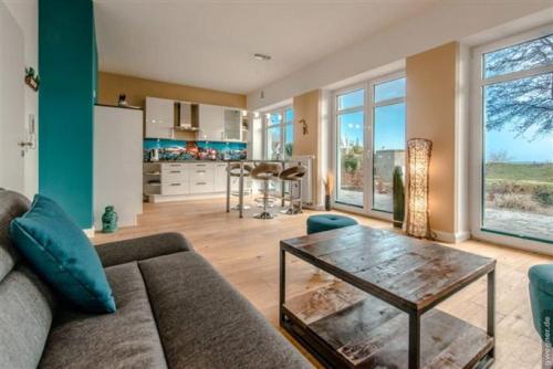 a living room with a couch and a table at Orth P1 - Surf and Chill in Orth