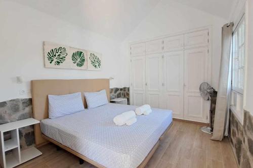 Ένα ή περισσότερα κρεβάτια σε δωμάτιο στο Costa Gaviotas Bungalow