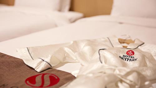 a bag of food sitting on top of a bed at Hotel Skypark Jeju 1 in Jeju