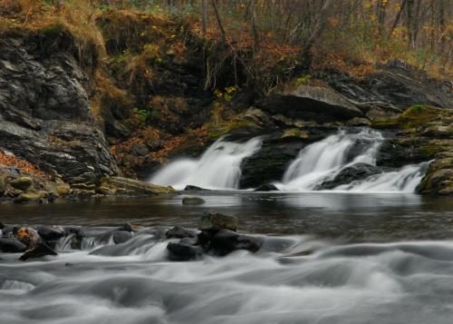 a waterfall on a river in the woods at Hotel Kolonie in Frýdlant nad Ostravicí
