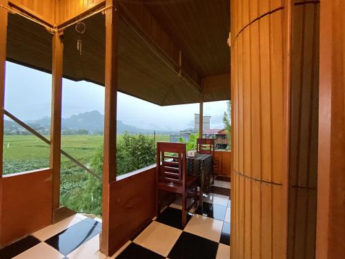 a view from the porch of a house with a view at THE SINGKI HOME FAMILY in Rantepao