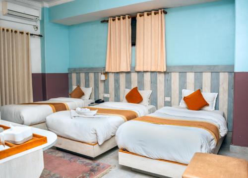 Postel nebo postele na pokoji v ubytování Hotel Kamana