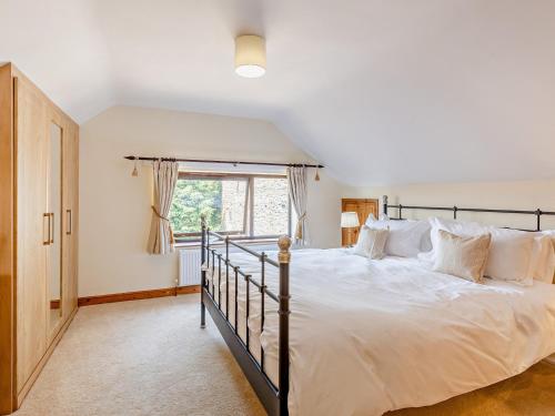 a bedroom with a large bed and a window at 2 bed property in Cleobury Mortimer 90642 in Hopton Wafers