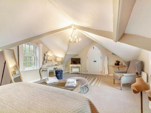 a attic bedroom with a bed and a table at 2 Bed in County Durham 90576 in Whittonstall
