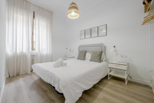 En eller flere senger på et rom på Elegante apartamento en el Centro de Madrid-Rastro