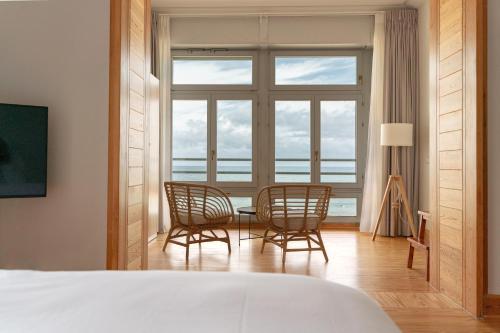 Ένα ή περισσότερα κρεβάτια σε δωμάτιο στο Pensión Antiguo Chalet de Zabala