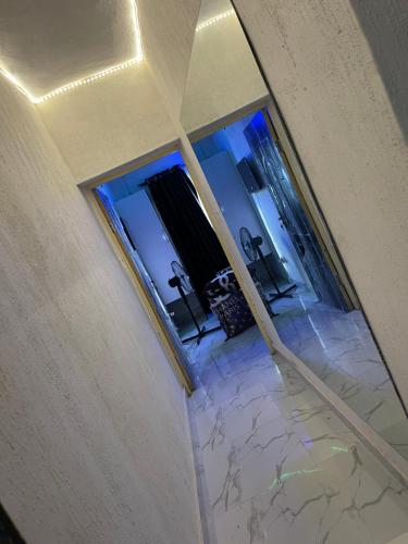 an empty room with a marble floor and a mirror at bdream home / dreamz apartment in Agege