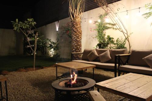 a fire pit in the middle of a patio at STAY Villa in Riyadh