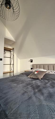 Een bed of bedden in een kamer bij Osada Karkonosze