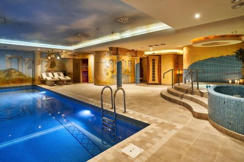 a house with a swimming pool in a room at Hotel Stara Poczta in Tychy