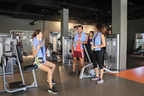 a group of people exercising in a gym at Aqua Fantasy Aquapark Hotel & Spa - Ultra All Inclusive in Kusadası